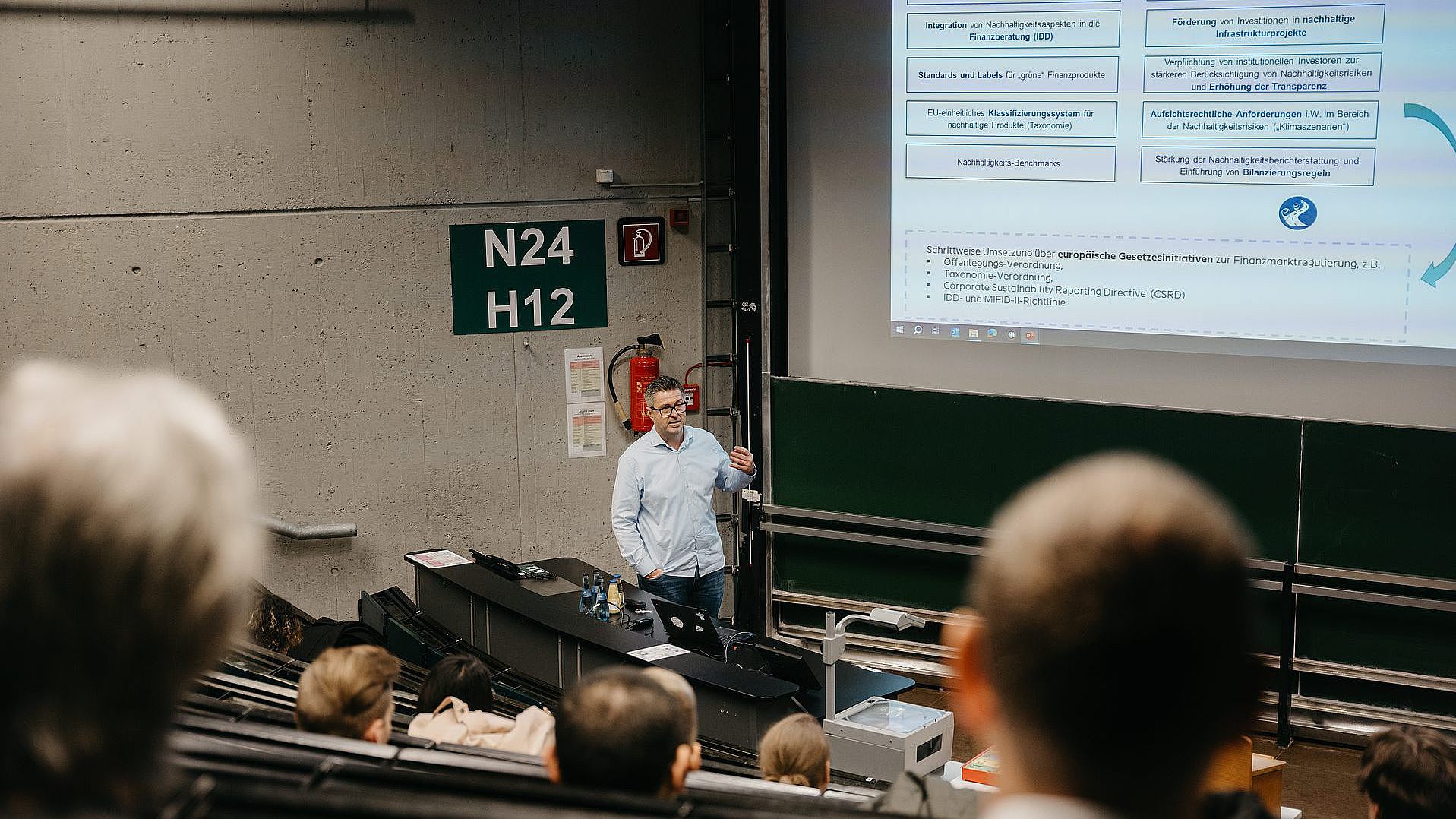 A company representative gives a presentation at the WiMa Congress 2024 in a lecture hall